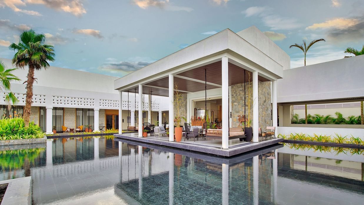A Central pool surrounded by luxurious buildings - Pramod Lands End Resort, a member of Radisson Individuals
